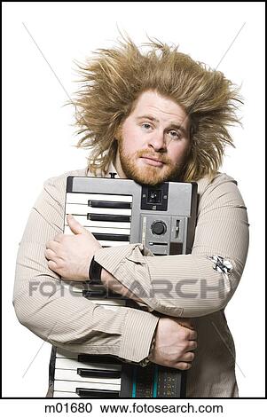Stock Image - man holding a keyboard. Fotosearch