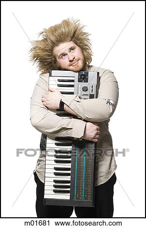 man holding a keyboard View Large Photo Image Stock Image - man holding a keyboard. Fotosearch