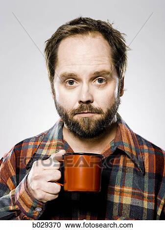 man holding a mug View Large Photo Image Stock Image - man holding a mug. Fotosearch