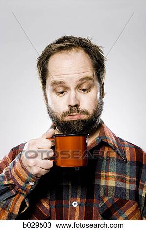 man holding a mug View Large Photo Image Stock Image - man holding a mug. Fotosearch