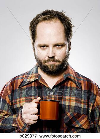 man holding a mug View Large Photo Image Stock Photo - man holding a mug. Fotosearch