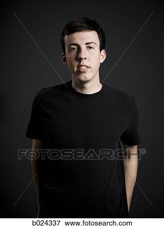 man in a black t-shirt View Large Photo Image Stock Photo - man in a black t-shirt. Fotosearch