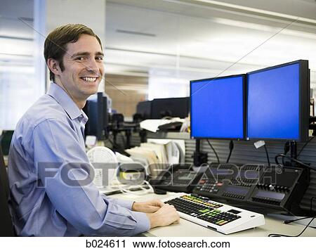 man in a blue shirt at work View Large Photo Image Stock Image - man in a blue shirt at work. Fotosearch