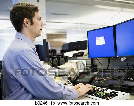 man in a blue shirt at work View Large Photo Image Stock Image - man in a blue shirt at work. Fotosearch