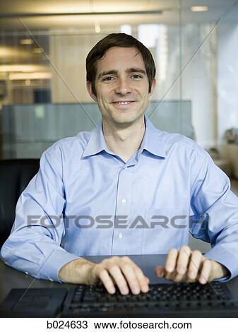 man in a blue shirt at work View Large Photo Image Stock Image - man in a blue shirt at work. Fotosearch