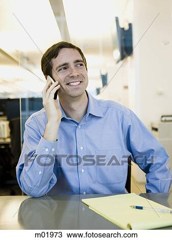 man in a blue shirt at work View Large Photo Image Stock Image - man in a blue shirt at work. Fotosearch