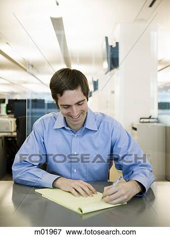 man in a blue shirt at work View Large Photo Image Stock Photo - man in a blue shirt at work. Fotosearch