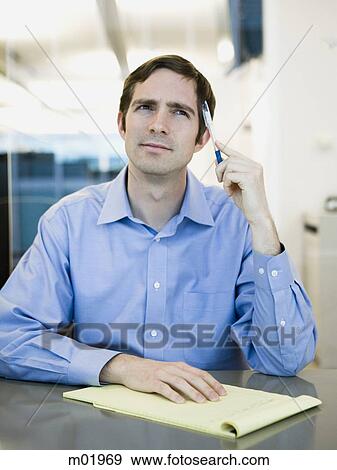 man in a blue shirt at work View Large Photo Image Stock Photo - man in a blue shirt at work. Fotosearch