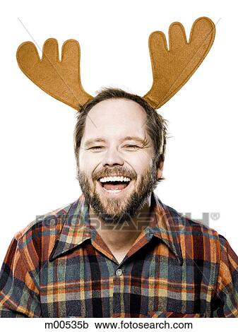 man in a plaid shirt wearing antlers View Large Photo Image Stock Image - man in a plaid shirt wearing antlers. Fotosearch