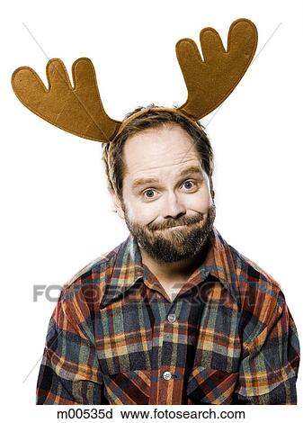 Stock Image - man in a plaid shirt wearing antlers. Fotosearch