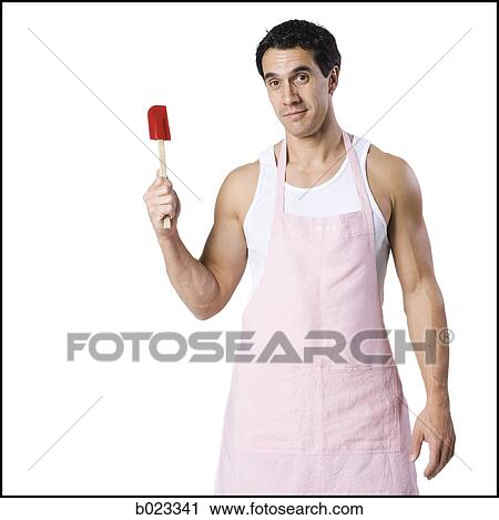 man in an apron with a spatula View Large Photo Image Stock Image - man in an apron with a spatula. Fotosearch