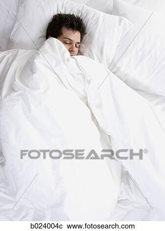 Stock Image - man in bed. Fotosearch
