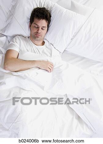 Stock Image - man in bed. Fotosearch