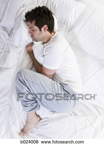 Stock Photo - man in bed. Fotosearch