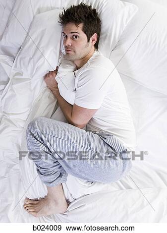 Stock Photo - man in bed. Fotosearch