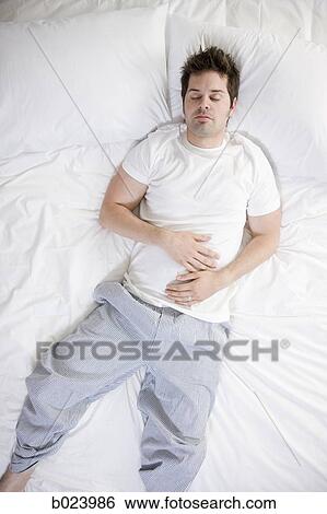 Stock Photograph - man in bed. Fotosearch