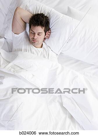 Stock Photograph - man in bed. Fotosearch