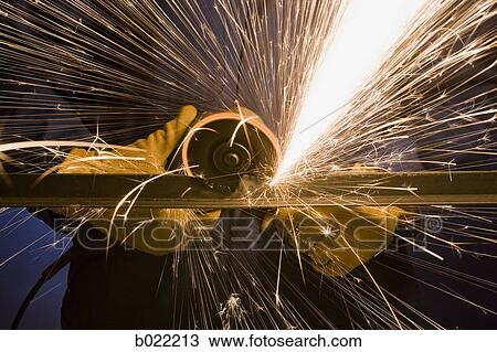 man in blue coveralls with a power grinder View Large Photo Image Stock Image - man in blue coveralls with a power grinder. Fotosearch