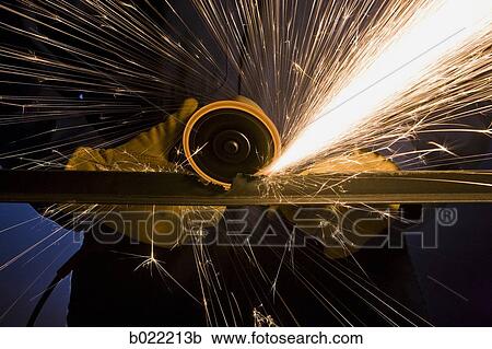 man in blue coveralls with a power grinder View Large Photo Image Stock Image - man in blue coveralls with a power grinder. Fotosearch