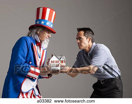 Man in Uncle Sam's costume giving model of house to other man, studio shot View Large Photo Image Stock Image - Man in Uncle Sam's costume giving model of house to other man, studio shot. Fotosearch