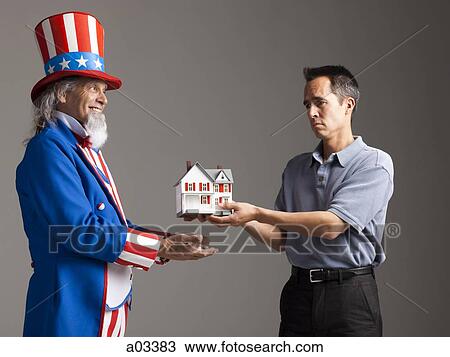 Man in Uncle Sam's costume giving model of house to other man, studio shot View Large Photo Image Stock Image - Man in Uncle Sam's costume giving model of house to other man, studio shot. Fotosearch