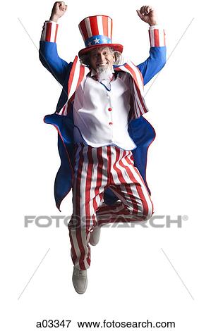 Stock Photo - Man in Uncle Sam's costume jumping with enthusiasm, studio shot. Fotosearch