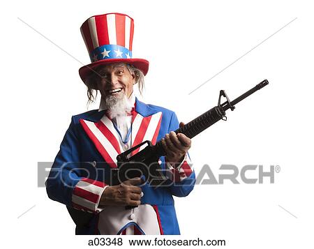 Man in Uncle Sam's costume with gun, studio shot View Large Photo Image Stock Photo - Man in Uncle Sam's costume with gun, studio shot. Fotosearch