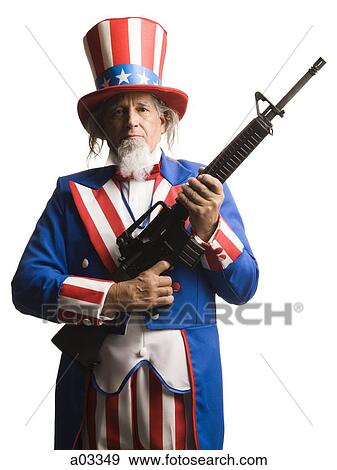 Man in Uncle Sam's costume with gun, studio shot View Large Photo Image Stock Photo - Man in Uncle Sam's costume with gun, studio shot. Fotosearch
