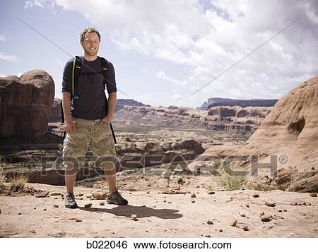 man on a hiking trip in the desert View Large Photo Image Stock Photograph - man on a hiking trip in the desert. Fotosearch