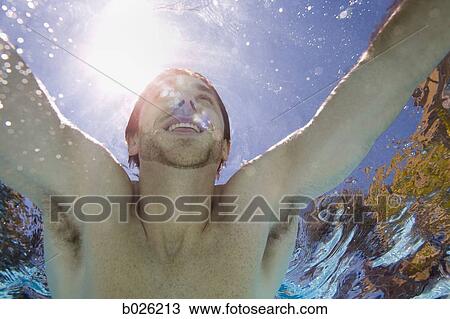 Stock Image - man underwater. Fotosearch