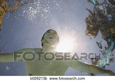 Stock Image - man underwater. Fotosearch