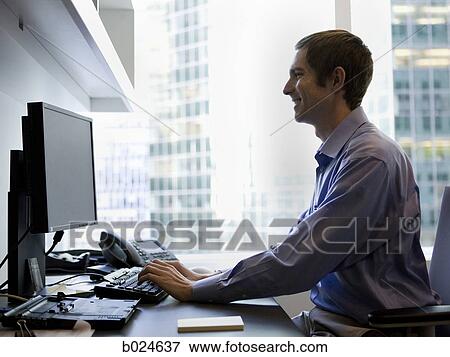 man using computer at work View Large Photo Image Stock Photo - man using computer at work. Fotosearch