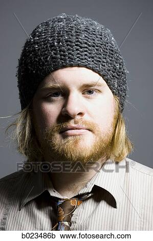 Stock Image - man wearing a beanie. Fotosearch