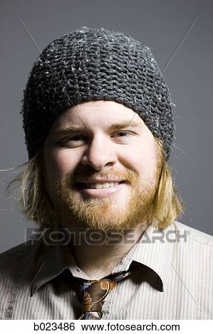 Stock Photograph - man wearing a beanie. Fotosearch