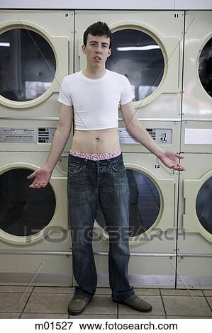 man wearing a shrunken t-shirt View Large Photo Image Stock Photo - man wearing a shrunken t-shirt. Fotosearch