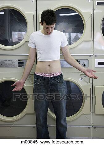 Stock Photography - man wearing a shrunken t-shirt. Fotosearch
