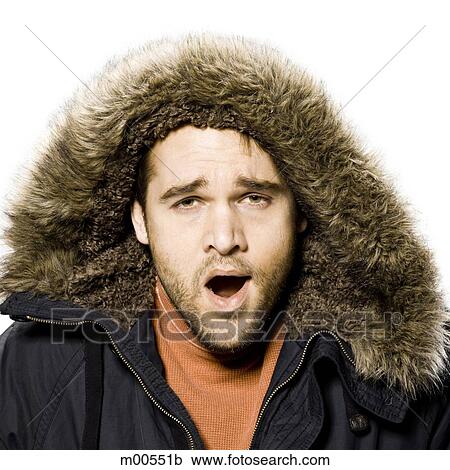 man wearing a winter coat with a fur trimmed hood View Large Photo Image Stock Image - man wearing a winter coat with a fur trimmed hood. Fotosearch