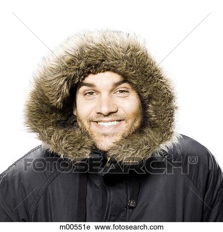 man wearing a winter coat with a fur trimmed hood View Large Photo Image Stock Image - man wearing a winter coat with a fur trimmed hood. Fotosearch
