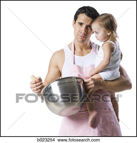 Picture - man with baby and mixing bowl. Fotosearch