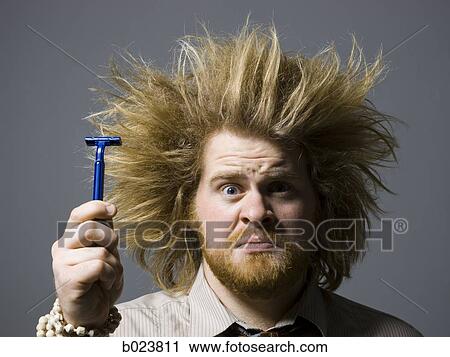 man with crazy hair holding a razor View Large Photo Image Stock Image - man with crazy hair holding a razor. Fotosearch