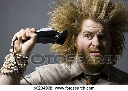 man with crazy hair holding hair clippers View Large Photo Image Stock Image - man with crazy hair holding hair clippers. Fotosearch