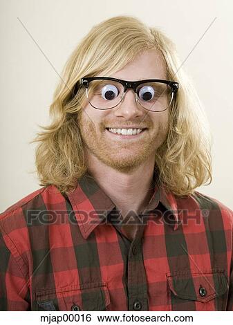 man with toy eyes over his eyes View Large Photo Image Stock Photograph - man with toy eyes over his eyes. Fotosearch