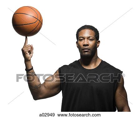 Mid adult man spinning basketball in air, portrait View Large Photo Image Stock Photo - Mid adult man spinning basketball in air, portrait. Fotosearch