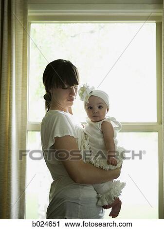Stock Image - mother and baby girl. Fotosearch