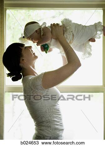 Stock Image - mother and baby girl. Fotosearch