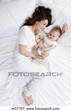 mother and baby in bed View Large Photo Image Stock Photo - mother and baby in bed. Fotosearch