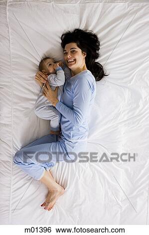 mother and baby in bed View Large Photo Image Stock Photograph - mother and baby in bed. Fotosearch