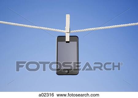 MP3 player hanging on washing line View Large Photo Image Stock Photograph - MP3 player hanging on washing line. Fotosearch