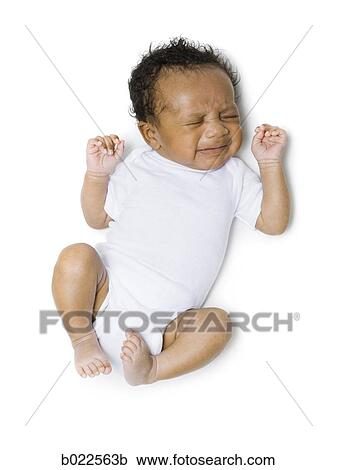 Stock Image - newborn baby in white. Fotosearch