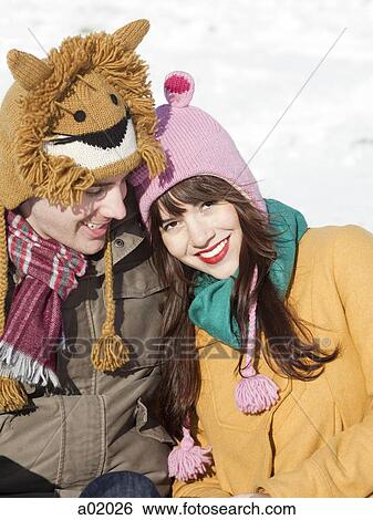 Stock Photograph - Orem, Utah, USA, boyfriend and girlfriend wearing funny knit hats, portrait. Fotosearch